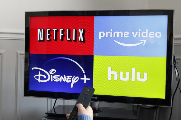 In this photo illustration, the logos of media service providers, Netflix, Amazon Prime Video, Disney + and Hulu are displayed on the screen of a television on November 20, 2019 in Paris, France.