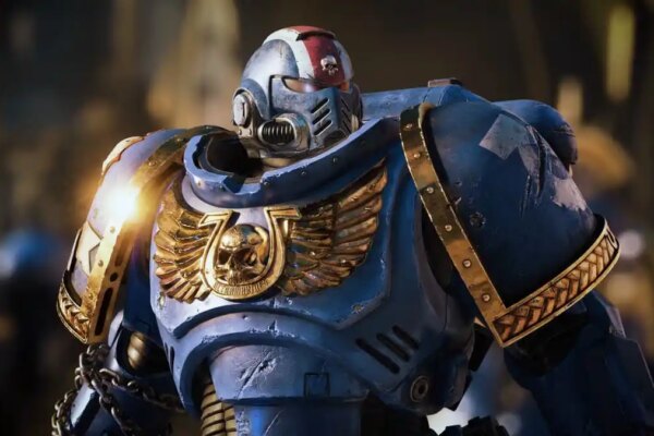 A closeup shot of a character in blue armor in Warhammer 40K Space Marine 2.