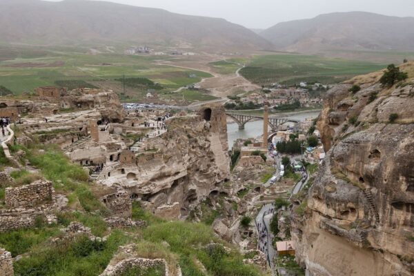 An view from up high showing an ancient city set into a hillside