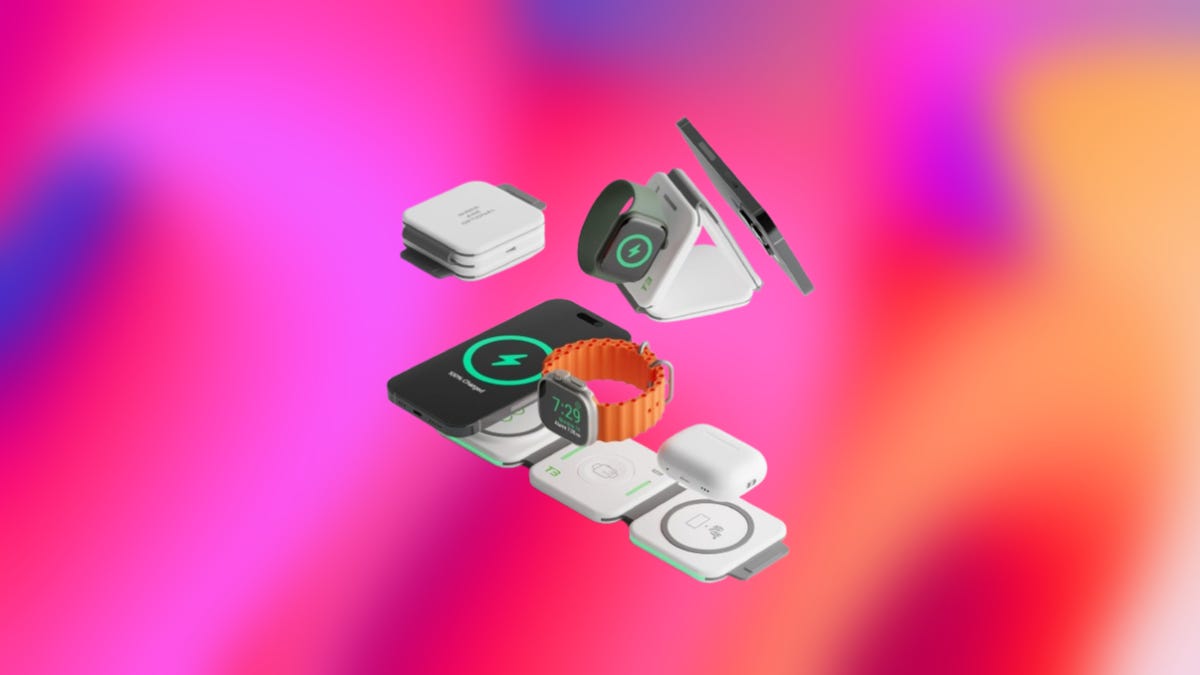 Infinacore Wireless charging station charging Apple Watch, AirPods and iPhone displayed against a gradient hot pink and orange background