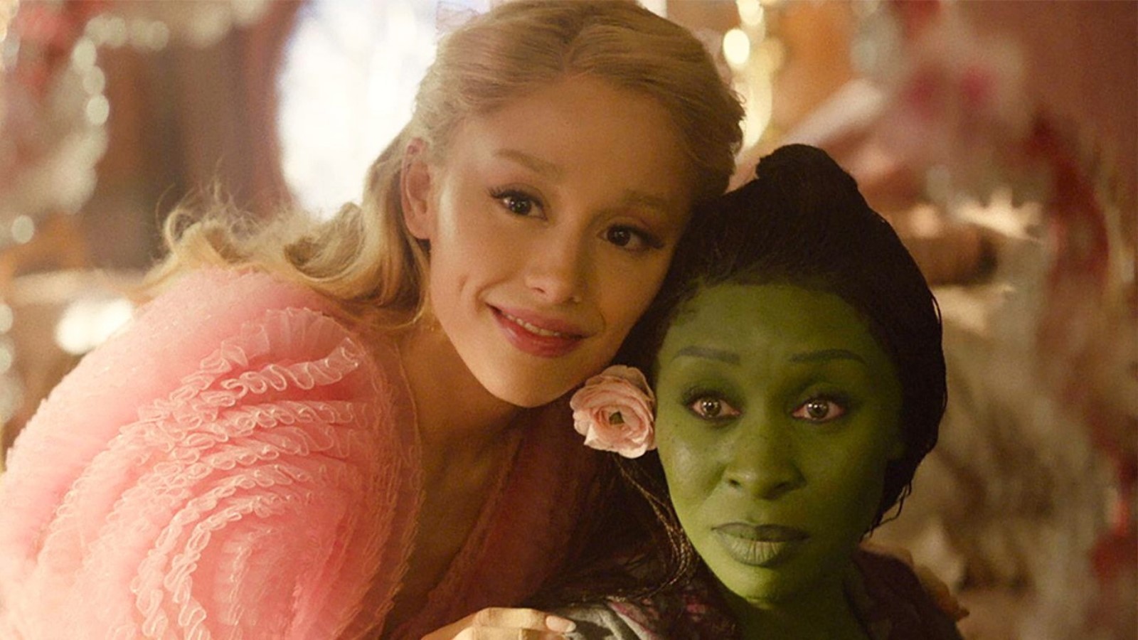 Elphaba and Glinda look over a toy version of Oz in Wicked movie